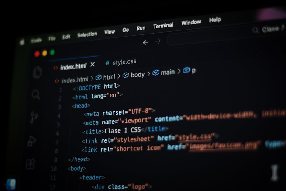 The image displays a close-up of a computer screen with lines of colorful programming code, including syntax highlighting in shades of blue, yellow, orange, and red. The code appears to be JavaScript,